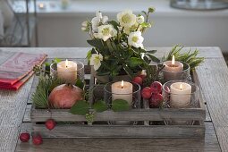 Wooden box as Advent wreath with 4 candles, pot with Helleborus niger