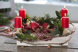 Fruit box as unusual Advent wreath filled with apples