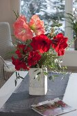 Winter bouquet with Hippeastrum 'Red Lion', 'Sweet Pink' (Amaryllis)
