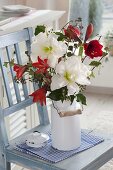 Red and white winter bouquet: Hippeastrum 'White Peacock', 'Hummingbird Red', 'Red Lion'
