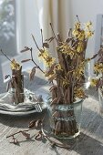 Table decoration with witch hazel and hazel twigs