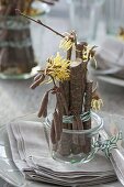 Table decoration with witch hazel and hazel twigs