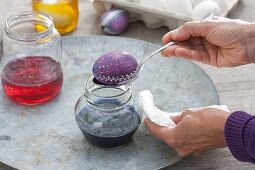 Egg coloring with wax reservation technique