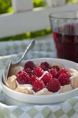 Quick dessert with raspberries (Rubus) on cream and ladyfingers