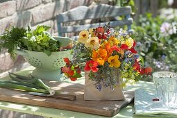 Colourful bouquet of Tropaeolum (nasturtium), bean blossoms