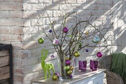 Christmas bouquet made of dry branches with tree decorations