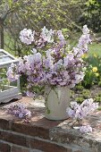 Lush bouquet with flowers of Prunus subhirtella and sargentii