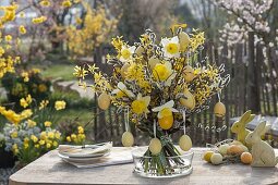 Woman decorates Easter bouquet