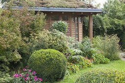 Late summer garden at the garden house with green roofs
