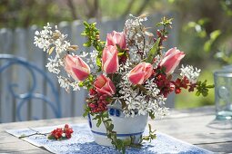 Bouquet of Chaenomeles (ornamental quince) twigs and Amelanchier