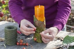 Natural candle deco on the window