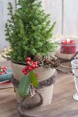 Christmas table decoration with bales of straw on the terrace