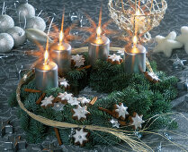 Advent wreath made of fir branches, cinnamon sticks