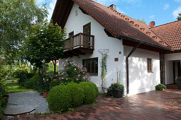 Rural property with paved driveway, Buxus