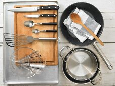 Kitchen utensils for making snapper adobo with a pepper ragout