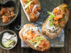 Smoked salmon steak crostini with fresh cheese and horseradish