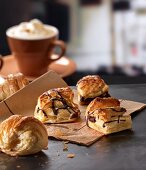 Pastries with chocolate and a latte in a cafe