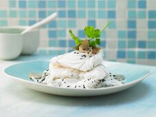 Steamed cod cuts with an algae and coriander pesto and white radish