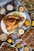 A roast turkey with side dishes for Thanksgiving