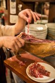 Freshly sliced ham at the 'Taberna La Dolores' in Madrid, Spain