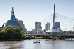 The Red River and the Esplanade Bridge with the Canadian Museum for Human Rights on the left and the skyline of Winnipeg, Province of Manitoba, Canada