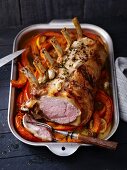 Veal loin with garlic on a bed of pumpkin wedges
