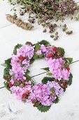 Luxuriant wreath of hydrangeas, berries and leaves