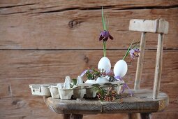 Flowers arranged in goose eggs in egg carton