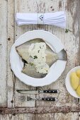 Plaice with lemon sauce and peeled potatoes