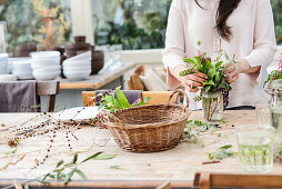 Woman arranging autumnal bouquet