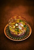 Ceviche in a marinade with pink pepper