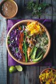 Power Bowl with quinoa, chicken, avocado, vegetables and peanut dip