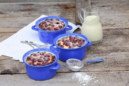 Cherry clafoutis with powdered sugar and vanilla sauce