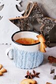 Shortbread Christmas cookies for cups, vintage cup of hot tea in knitted cup holder