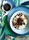 Rice pudding with raisins, almonds and coconut syrup