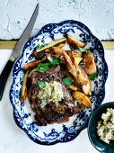 Skirt steak with pepita-lime butter and roasted potatoes