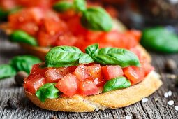 Tomato bruschetta with chopped tomatoes and basil on toasted bread
