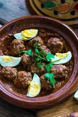 Moroccan meatballs with egg and parsley