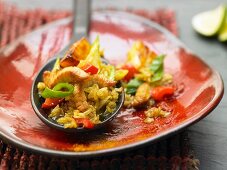 Brown rice with chicken strips, pineapple and peppers