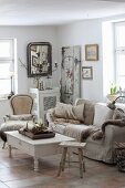 Cosy, shabby-chic living room in natural shades