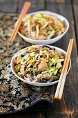 Soya pasta fried with chicken and mushrooms
