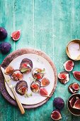 Buckwheat blinis with bacon cream and figs