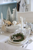 Festively set Christmas table in cream