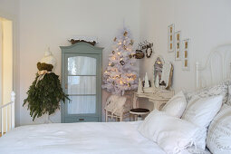 Christmas decorations in white vintage-style bedroom