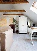 Mural in stairwell leading to attic room with wooden roof beams