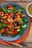 Sweet potato salad with aubergines, peppers and sesame seeds
