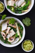Vegetable soup with tofu and edamame pesto