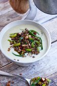 Leek and cheese soup with lentils and nuts