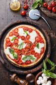 Mozzarella and tomato pizza with basil