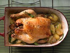 Roast aniseed chicken with potatoes, onions and garlic